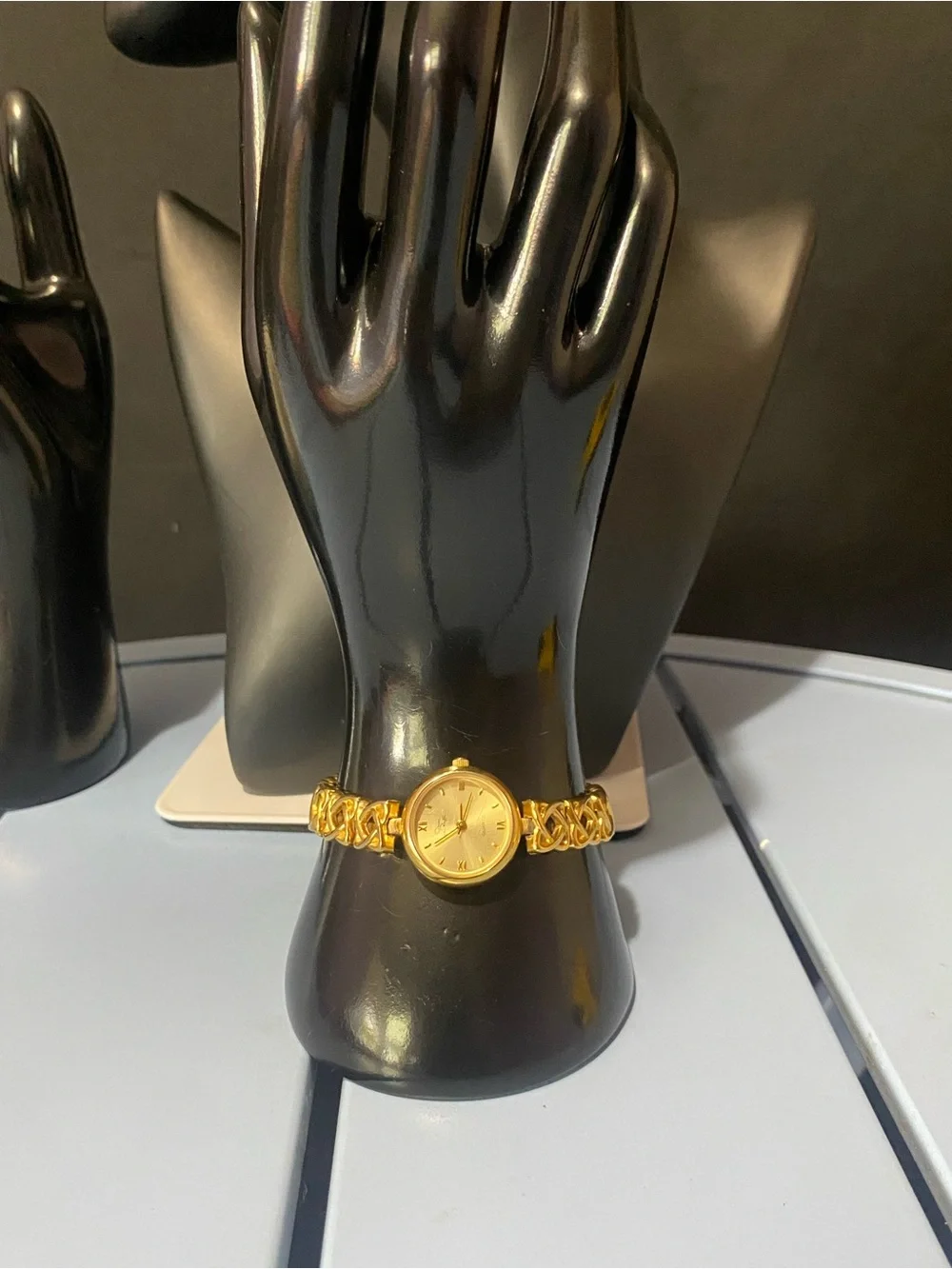 Decan De La Renta gold tone designer watch